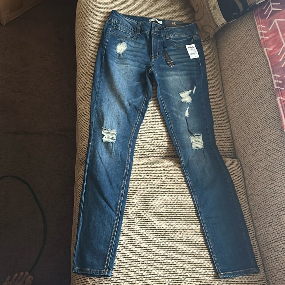 New and never worn. Size 6, Refuge brand skinny jeans.